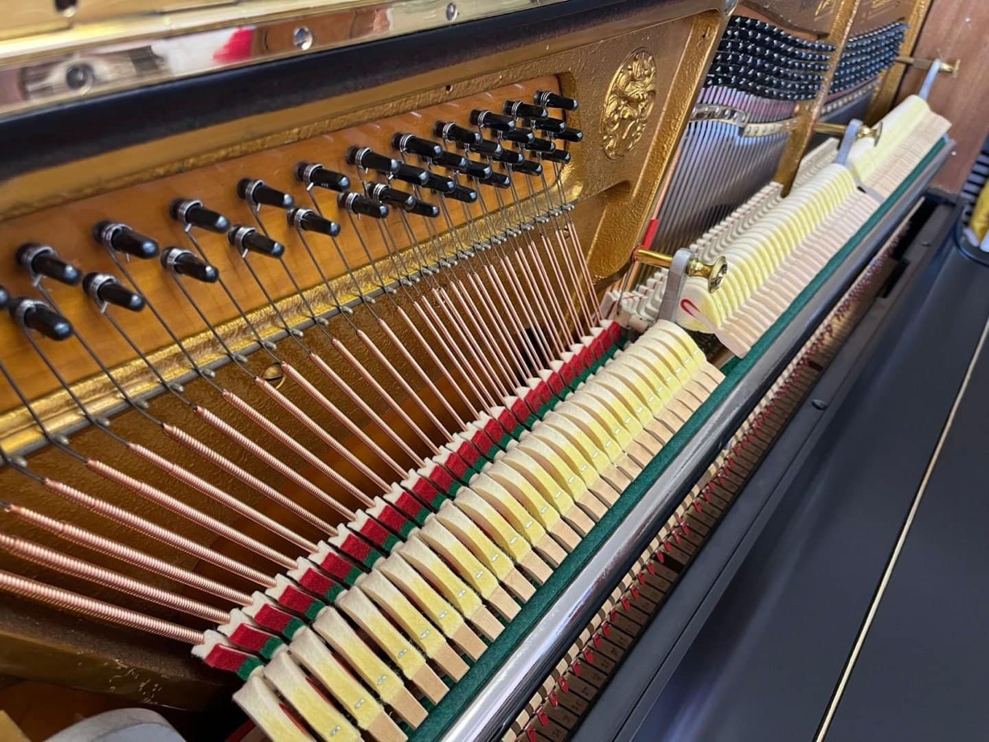 Strings and dampers inside an open piano