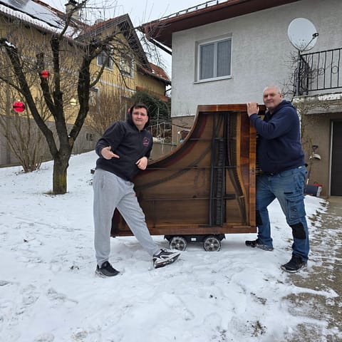 Piano being collected for disposal