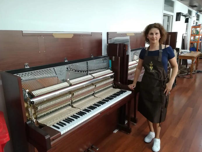 Krisi Mileva, owner of MK Klavier Art, at an open piano