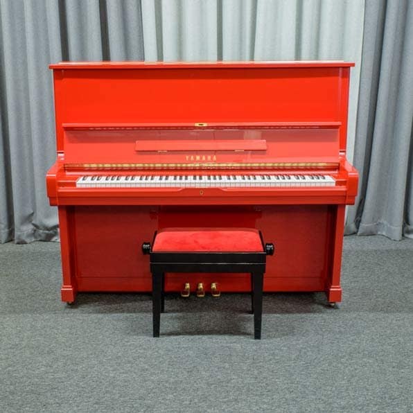 Red Yamaha upright piano
